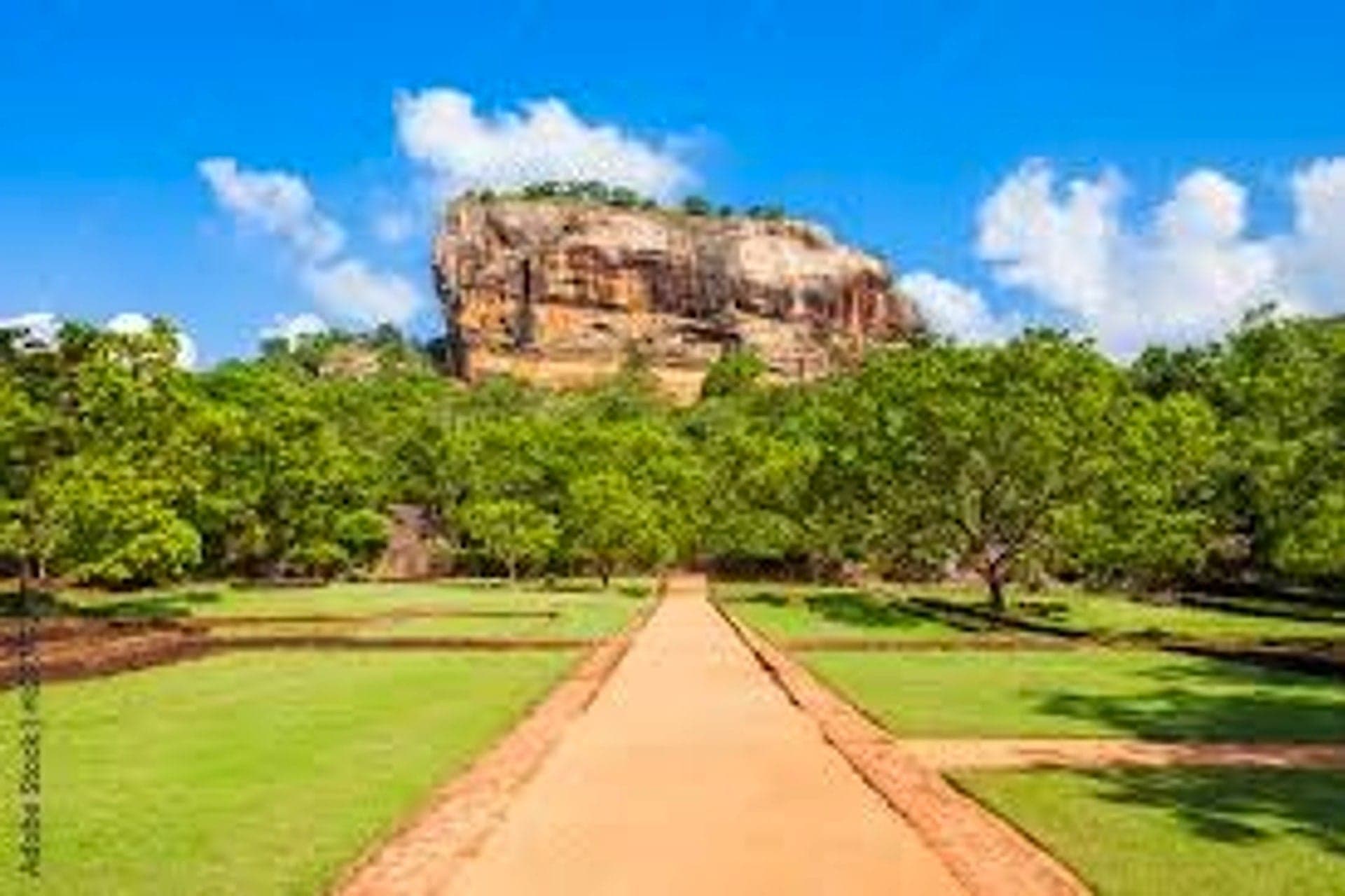 Sigiriya Rock Fortress surrounded by tropical countryside in Sri Lanka