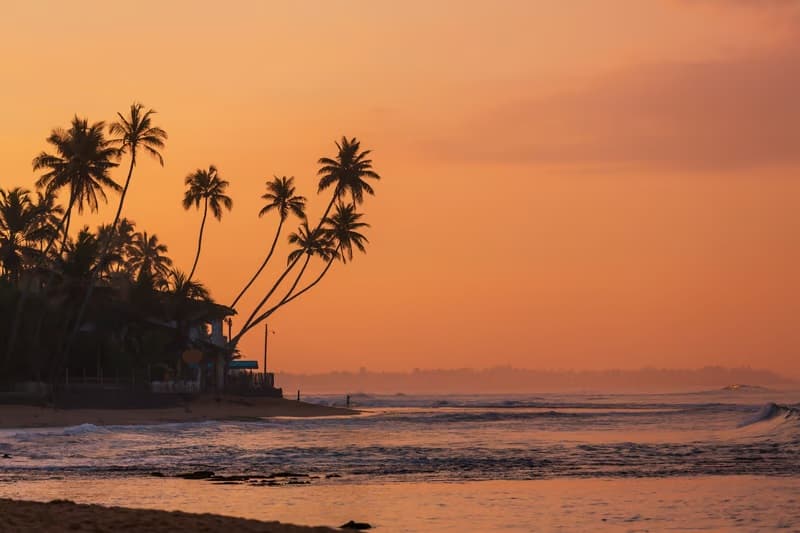 Sunset over the coastline at Hikkaduwa