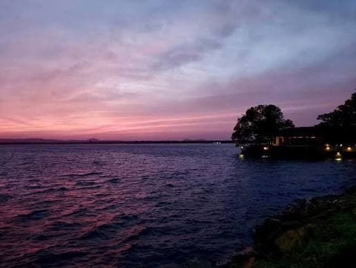 Sunset over a peaceful lake landscape near Polonnaruwa