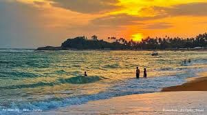 Sunset over Unawatuna Beach on Sri Lanka's southern coast
